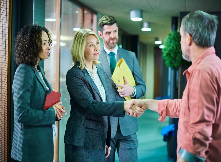 Group of personal injury lawyers discussing a case in Brooklyn, NY